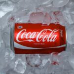 coca cola plastic bottle on white textile