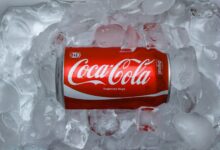 coca cola plastic bottle on white textile