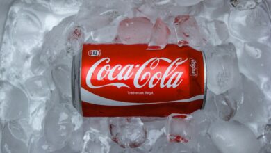 coca cola plastic bottle on white textile